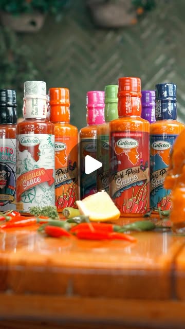 The Calisto&rsquo;s peri-peri sauce range with fresh chillies on a board